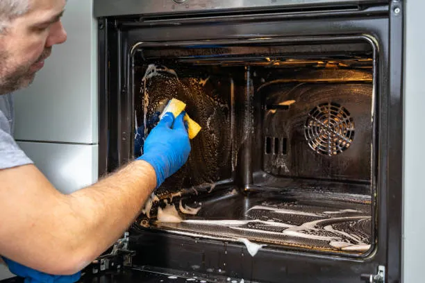cleaning-a-dirty-oven-in-the-kitchen